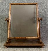 An early 19th century swing framed mahogany toilet mirror. H.58 W.49 D.23cm
