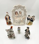 A collection of Staffordshire porcelain and a Wedgwood hand painted figure. H.35cm (largest)