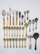 WITHDRAWN - A collection of silver plated flatware and sixteen gold plated teaspoons and a soup