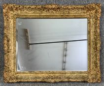 A 19th century style gilt framed wall mirror with bevelled plate. H.51 W.64cm