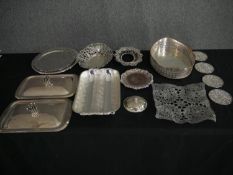 A mixed collection of silver plate; trays, tureens, coasters etc. L.31 W.23cm. (largest).
