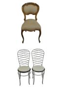 A Louis XV style gilt dining chair H.84cm and a pair of wrought iron garden side chairs with squab