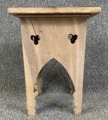 An Eastern carved hardwood stool with studded decoration. H.39cm