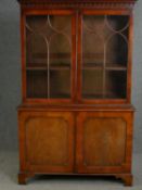 A two section Georgian style mahogany library bookcase, early 20th century. H.186 W.120 D.48cm.