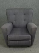 A contemporary retro styled armchair. H.74cm.