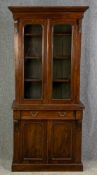 A 19th century walnut two section library bookcase. H.202 W.90 D.39cm