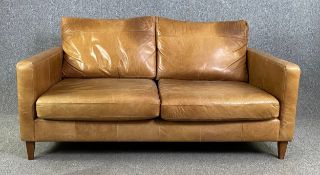 A contemporary retro styled John Lewis sofa in light tan leather upholstery. H.90 W.172 D.105cm