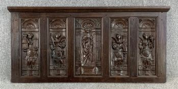 A five section relief carved oak panel depicting various saints, 18th century, possibly earlier,