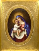 A 19th century Russian oil on stone panel, Madonna and child in gold leaf frame with Cyrillic