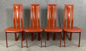 A set of four 1970's vintage dining chairs upholstered in faux leather. H.106cm (each)