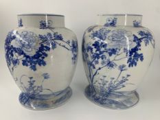 A pair of 19th century Japanese blue and white baluster form vases decorated with birds and flowers.