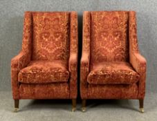 A pair of contemporary Edwardian style armchairs on square tapering mahogany supports terminating in