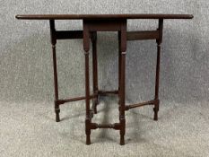 A 19th century mahogany drop leaf occasional Sutherland table. H.61 W.25 (76cm extended) D.76cm