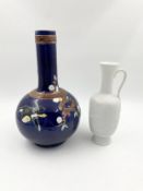 A Chinese ceramic vase and another marked Kaiser, Germany. H.32cm (largest)