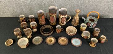 An extensive collection of mid century hand painted Briglin studio pottery. H.26cm (largest)