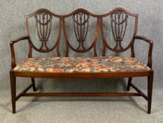 A C.1900 mahogany Hepplewhite style chair back settee or hall seat. H.101 W.136 D.54cm