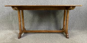 A mid 20th century limed oak refectory dining table in the Heal's style. H.75 W.153 D.76cm