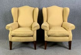 A pair of Georgian style wingback armchairs on square tapering supports. H.102 W.83 D.94cm