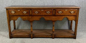 An 18th century style oak dresser by Titchmarsh & Goodwin. H.77 W.168 D.46cm