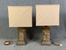 A pair of distressed painted and carved table lamps. H.74cm (each)