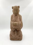 A carved stone Chinese figure. H.45cm