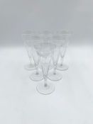 A set of six Victorian etched vine design glass champagne flutes. H.18cm (each)