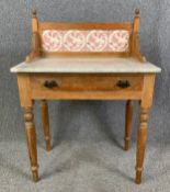 A Victorian pine washstand with marble top and tiled back. H.105 W.75 D.46cm