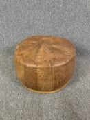 A vintage North African leather pouffe. Dia.47cm