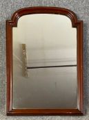 A mid 20th century mahogany framed wall mirror with arched plate. H.78 W.55cm