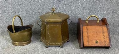 A collection of coal boxes: Arts and Crafts brass with implements, Victorian oak and one a brass