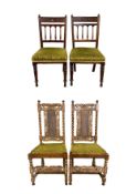 A pair of mid century limed oak Carolean style dining chairs with pad cushions on panel seats