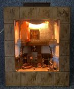 A cased diorama, country house interior with figures, wired and lit. H.31 W.42 D.25cm