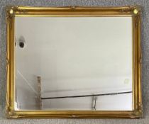 A contemporary gilt framed mirror with a bevelled plate. H.100 W.129cm