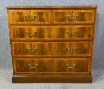 A Georgian style mahogany and crossbanded chest of drawers. H.87 W.93 D.47cm