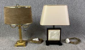 Two table lamps. One twin branch Corinthian column in brass and one Japan lacquered with mother of