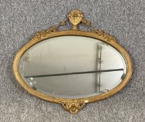 A C.1900 gilt framed mirror with a bevelled plate. H.49 W.54cm