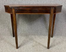 A 19th century mahogany side or console table on reeded tapering supports. H.72 W.92 D.45cm