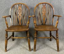 A pair of 19th century beech and elm Windsor wheelback armchairs. H.98 W.56 D.50cm (each)