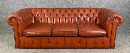 Chesterfield sofa, three seater in light tan deep buttoned and studded leather upholstery. H.65 W.