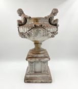 A distressed painted terracotta urn in the classical style. H.48cm