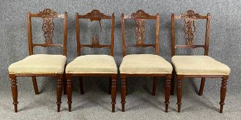 A set of four 19th century carved walnut dining chairs. Damage as seen. H.90cm (each)