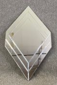 A contemporary Art Deco style mirror with bevelled plate. H.105 W.61cm