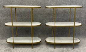 A pair of contemporary Art Deco style gilt metal etageres with three marble shelves. H.63 W.56 D.