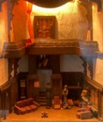 A cased diorama, country house interior with figures, wired and lit. H.31 W.42 D.25cm