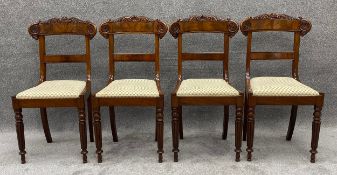 A set of four Regency carved mahogany dining chairs on tapering fluted supports. H.90cm (each)
