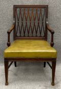 A mahogany George III elbow chair with faux leather upholstery. H.91 W.60 D.56cm