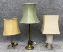Two brass table lamps and a marble neoclassical style urn form lamp. All with shades. H.77cm (
