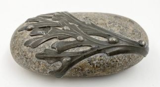 A stone and lead mounted sculpture, indistinctly signed. W.13cm