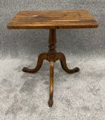 A 19th century rosewood lamp table on tripod cabriole supports. H.45 W.46 D.36cm