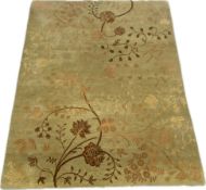 An Indian woollen deep pile carpet with scrolling foliate decoration. H.306 W.247cm